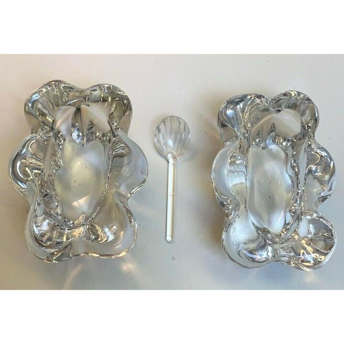 Daum France Pair of Floral Form Crystal Salts, Salt: Pair of dainty but heavy signed Daum France floral form clear crystal salts, salt cellars with spoon. 2" L X 2 3/4" W X 1 1/2" H.