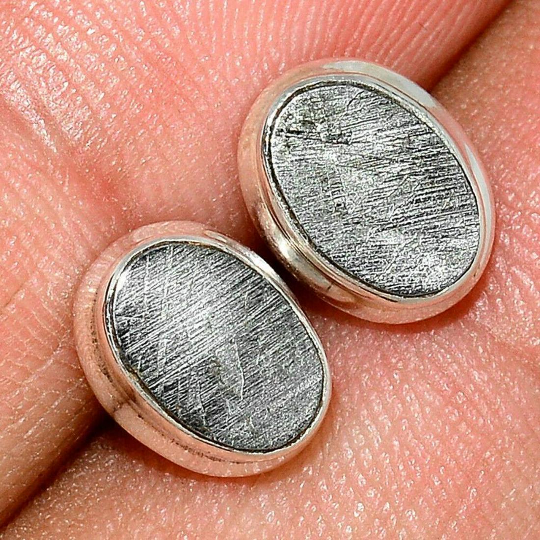 Swedish Meteorite Sterling Silver Post Earrings: Muonionalusta Meteorite slices from Sweden, mounted into sterling silver post earrings. 2.7 grams weight (including gemstone & silver). The Muonionalusta meteorite is a meteorite classified as fine oc