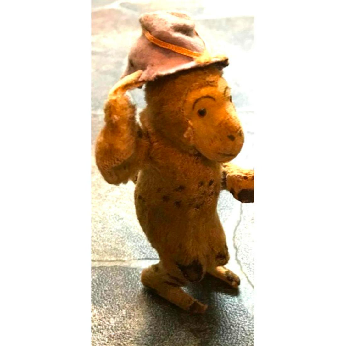 Vintage Japan Dandy Wind Up Monkey Toy: Vintage Japanese wind up toy by Dandy. Mohair, felt & glass eyes. Toy monkey tips his hat. Approx 5" H. ** in used condition with losses, as seen in photos, & missing the original wind up key.