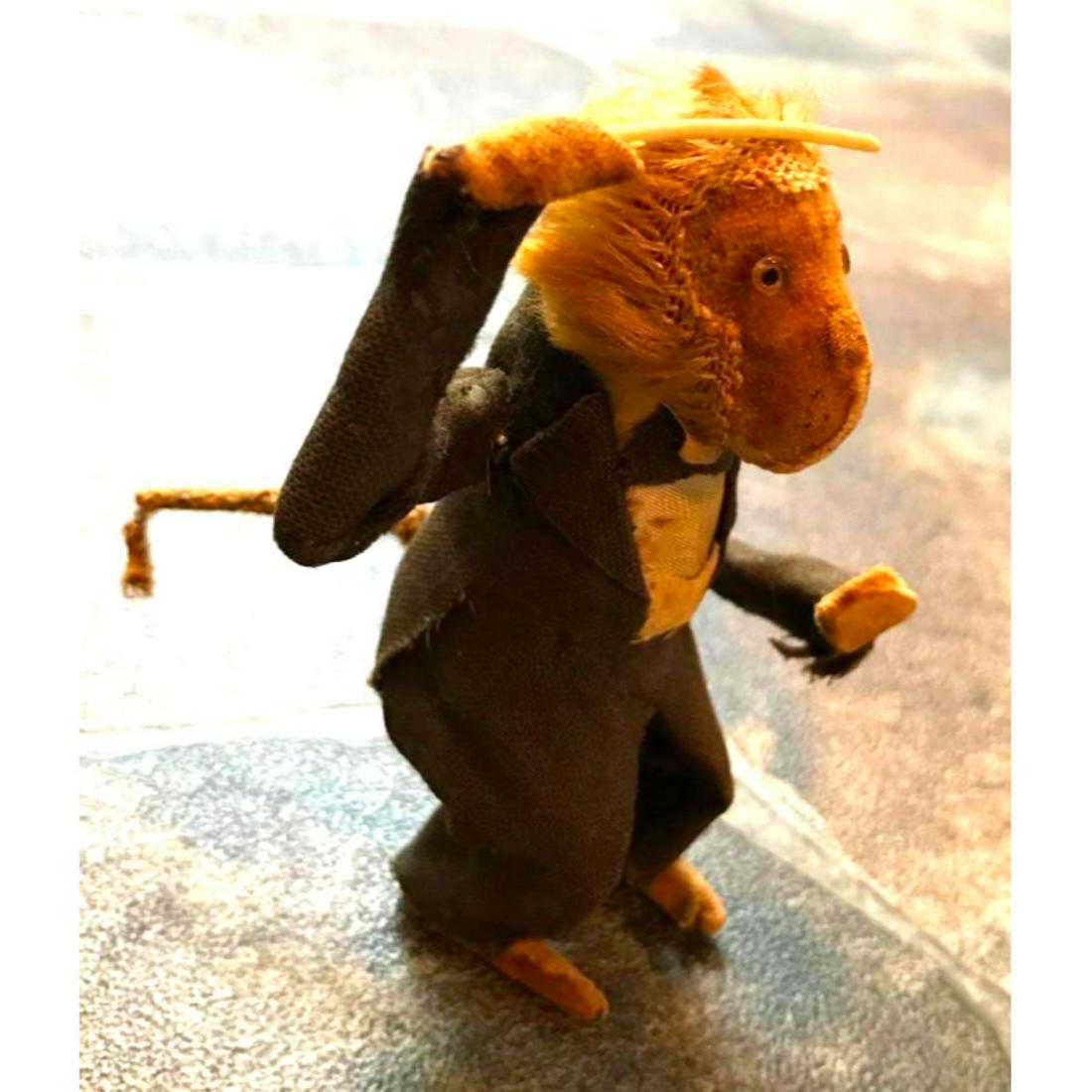 Vintage Japan Dandy Wind Up Monkey Toy: Vintage Japanese wind up toy by Dandy. Mohair, felt & glass eyes. Toy monkey orchestra leader in tuxedo. Approx 5" H. ** in used condition with losses, as seen in photos, & missing the original wind u