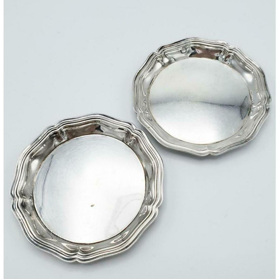 Pair of French Christofle Silver Plated Coasters: Pair of French Christofle silver-plated coasters. 3 3/8" D. Stamped with Christofle hallmark on reverse side.
