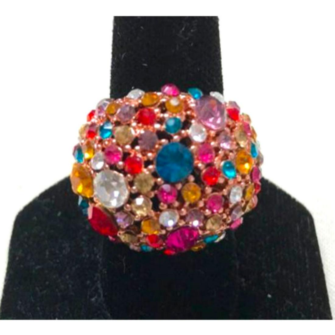 Multi-colored Crystals Circus Ring: Swarovski multi-colored crystals set into copper-tone metal statement ring. Unmarked. Size 9.