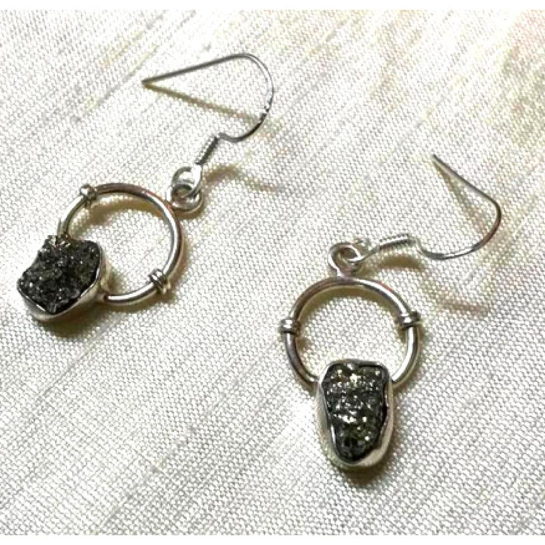 Natural Gemstone Mine Pyrite Chunks Sterling Silver: Sparkling gemstone mine natural pyrite chunks ( 6 X 9mm ) set into sterling silver circular design ear wire hooks, earrings. Each earring stamped 925 on the reverse.