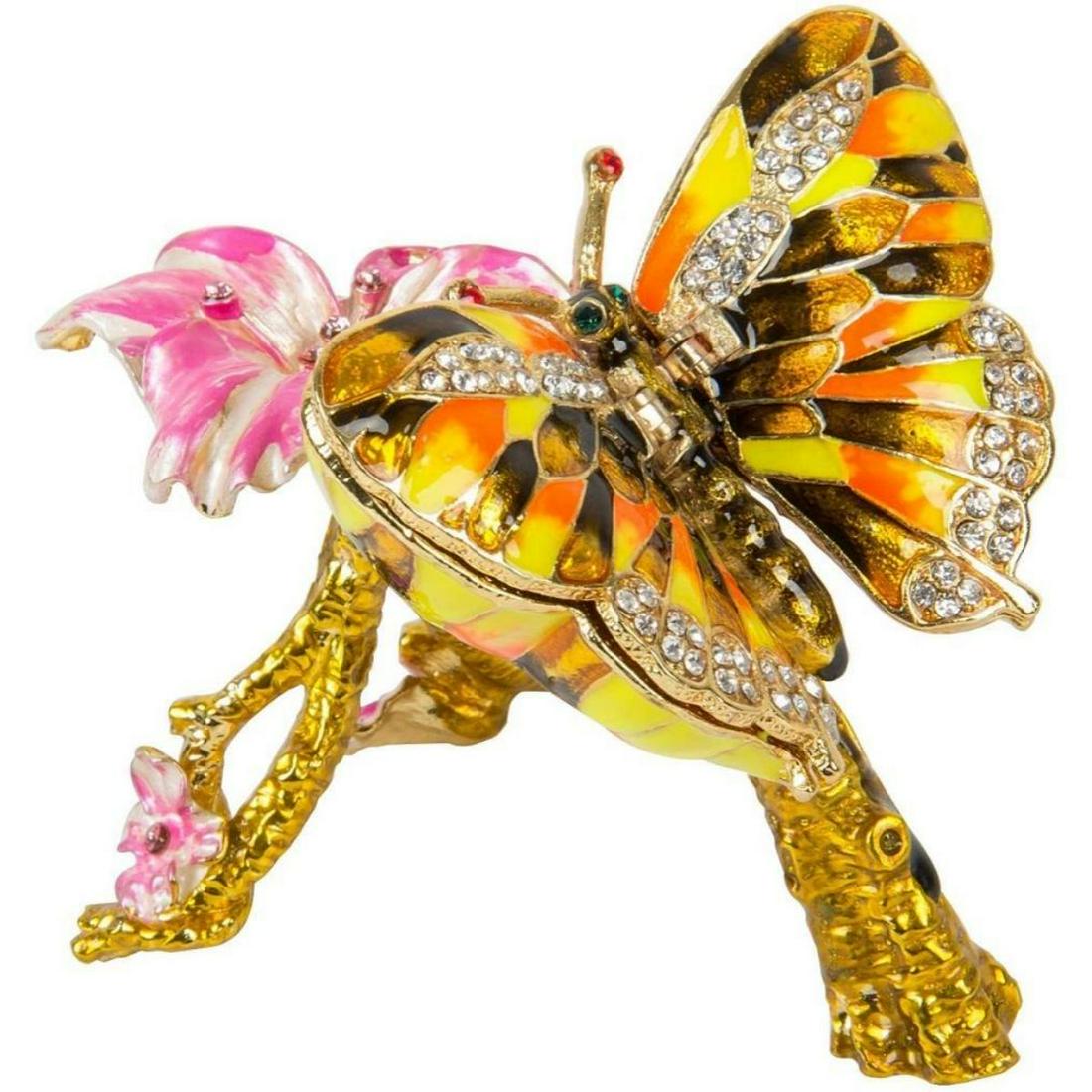 Enamel & Crystal Butterfly Trinket Jewel Box: Butterfly on flower branch trinket, jewel box. Enamel & gilt over pewter, with embedded Austrian crystals. Each wing lifts up to reveal two hidden enameled compartments for storing tiny treasures. 3"