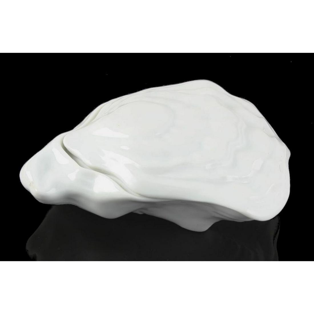 Limoges Porcelain Oyster Shell Trinket Box: Porcelain vanity or trinket box in the form of an oyster shell. Hallmarked on the inside lid "Limoges France" Approx 6" L X 5" W X 2 1/4" H. Excellent condition.