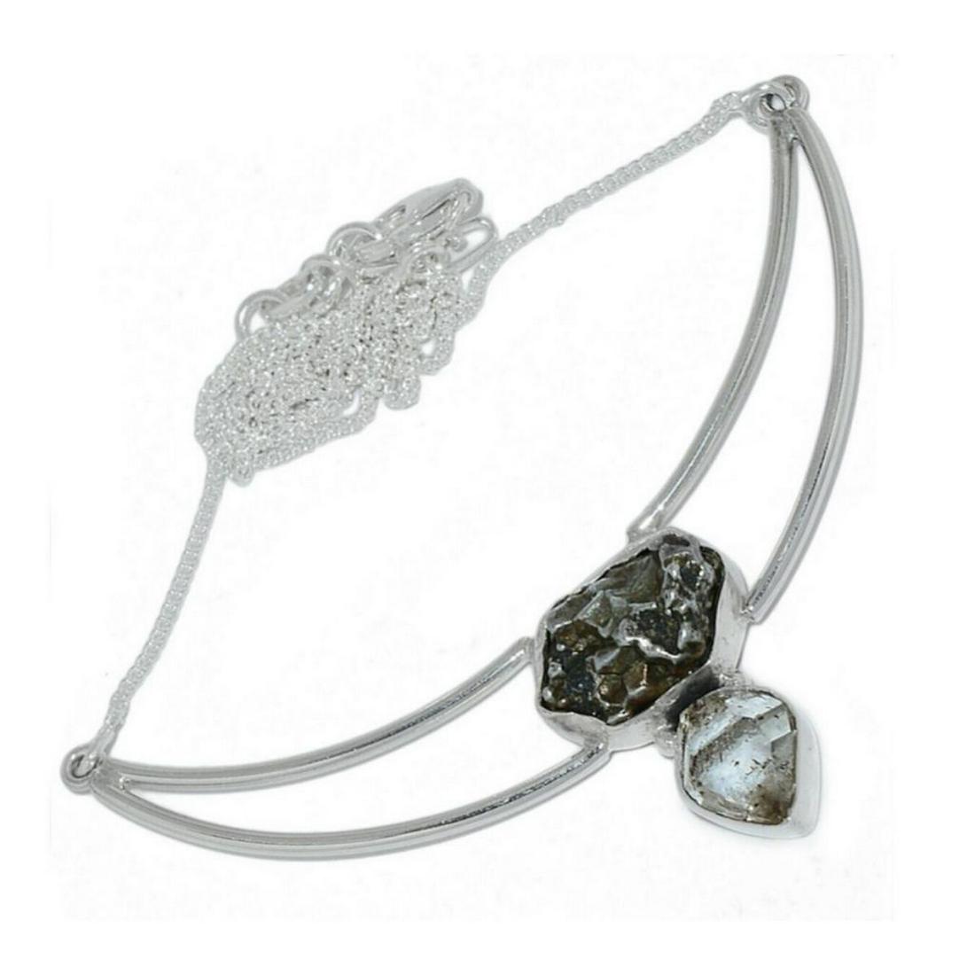 Meteorite Campo Del Cielo & Herkimer Diamond Sterling: Modern style sterling silver necklace set with 10x25mm meteorite stone ( Campo Del Cielo, Argentina origin ) along with a 9x11mm Herkimer diamond rough, 18" necklace. Stamped 925. 11.3 grams weight, g