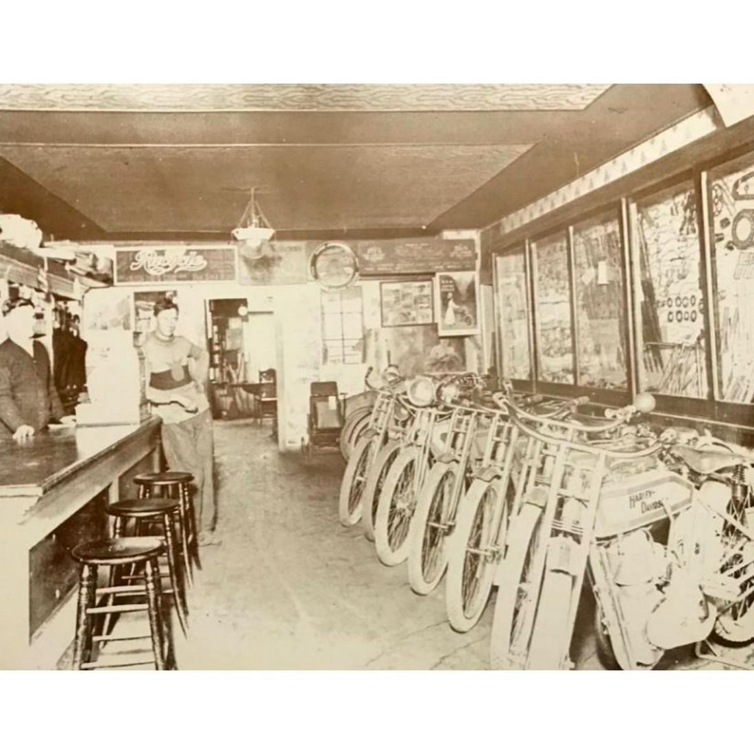 Early 1900's Harley Davidson Motorcycle Shop Photo: Harley Davidson motorcycle shop in the early 1900's sepia-tone photo print, created in the late 1980's - early 1990's, printed on cardstock. 11" X 14".