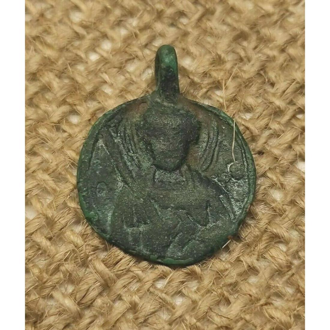 9th - 12th Century Byzantine Bronze Pendant Artifact: 9th-12th Century Byzantine bronze artifact, religious, pilgram's pendant. Found via metal detector in Kiev, Ukraine. Comes with display case. 20x25mm diameter, 1.5mm diameter hole in pendant's loop. B