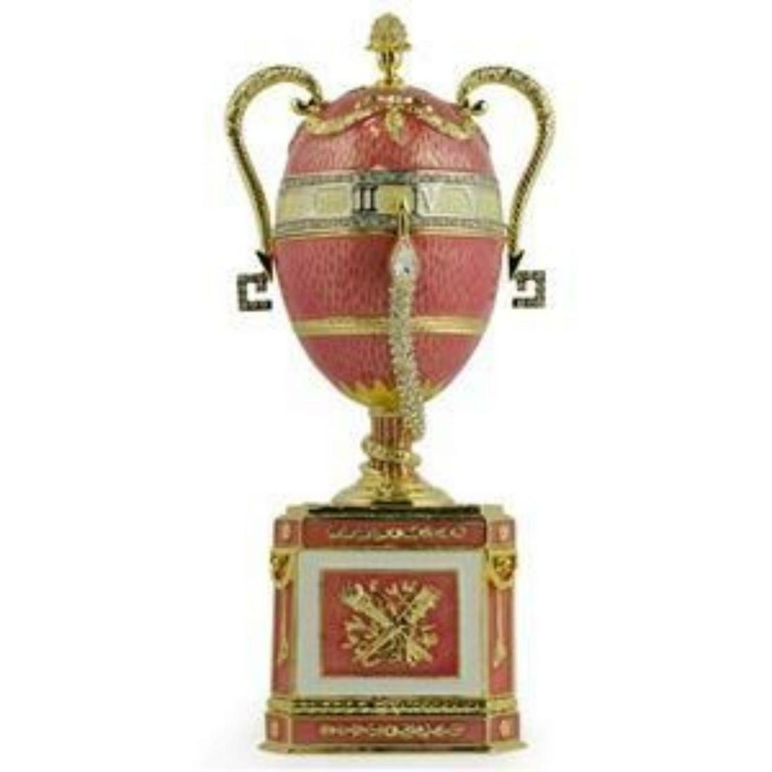 Faberge Inspired Trinket, Music Box Egg: Created after the original 1902 Duchess of Marlborough egg. Enamel & gilt over pewter, with embedded Austrian crystals. The top of the egg lifts off, with magnetic closure, to reveal an enameled inter
