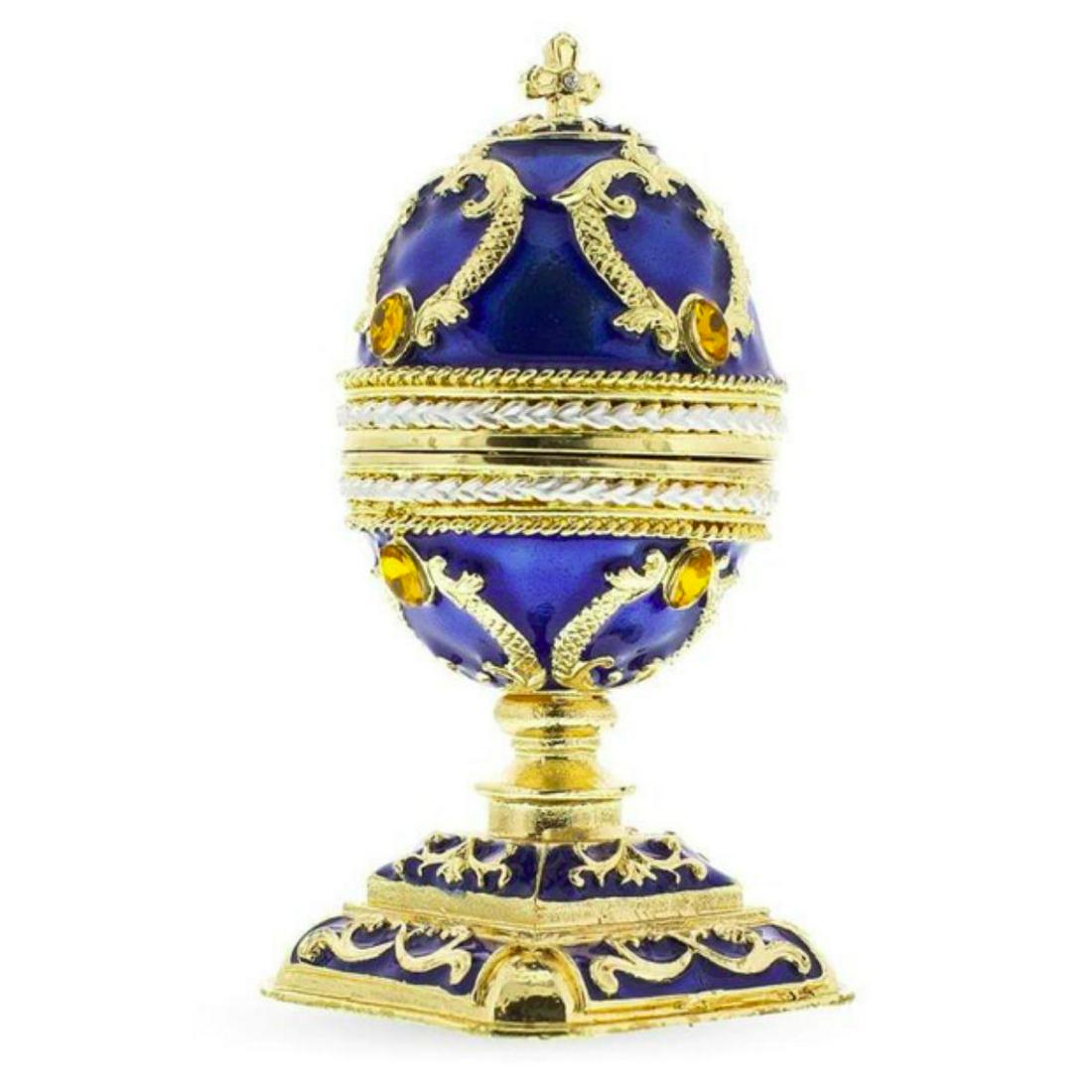 Russian Royal Cross Jewel Trinket Box Photo Egg: Russian Royal Cross egg, inspired by the original designs of Carl Faberge for the Russian Royal Family. Enamel & gold gilt over pewter with embedded Austrian crystals. The egg opens on a hinge at cent