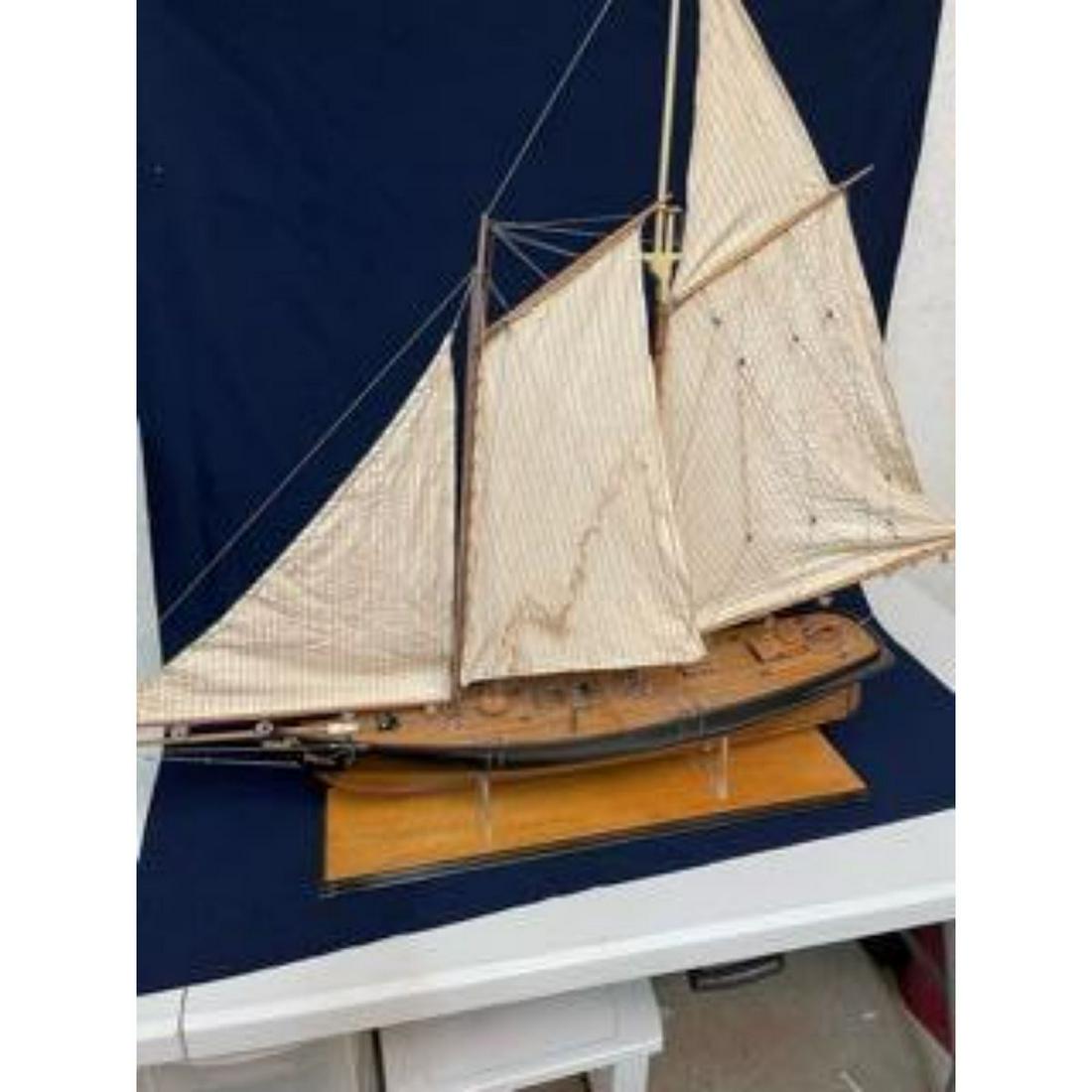 Wooden Sailing Yacht Model "Eagle": Gorgeous and antique reproduction of the sailing yacht "Eagle". Newer base was constructed for the antique hull. Features full rigging with hand sewn sails in a design not seen in a great while on mod