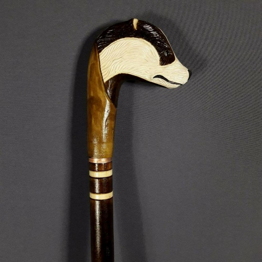 Honey Badger Carved Wooden Cane: Hand-carved honey badger walking stick, cane. Carved from linden tree wood by a Ukrainian artisan, with multi color stains. 35" H.