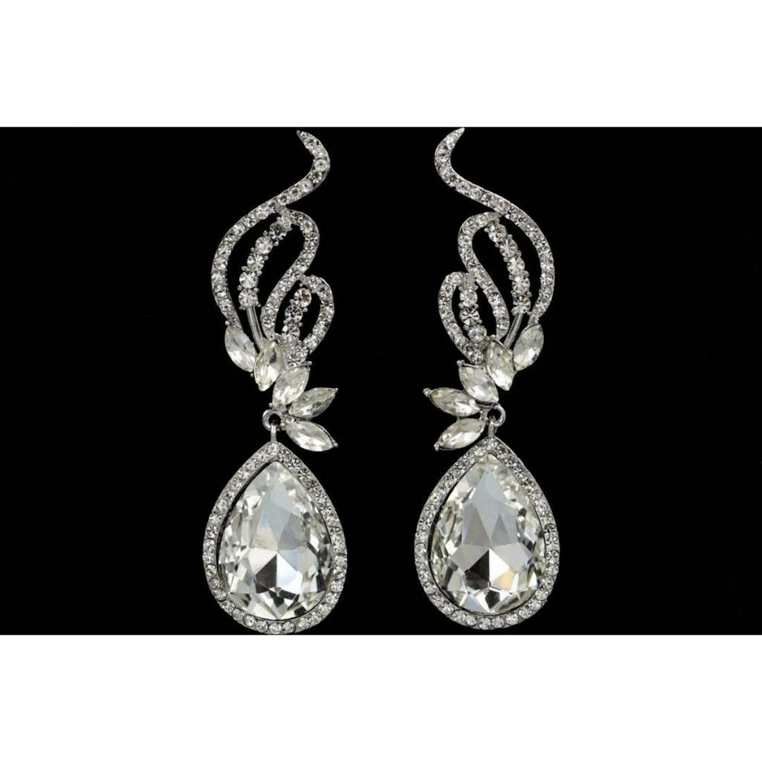 Clear Czech Crystal Teardrop Rhinestone Costume: Large Czech crystal teardrop focal stones, embellished with round & marquise-shaped crystals, set into rhodium-plated dangle earrings. 3"L.