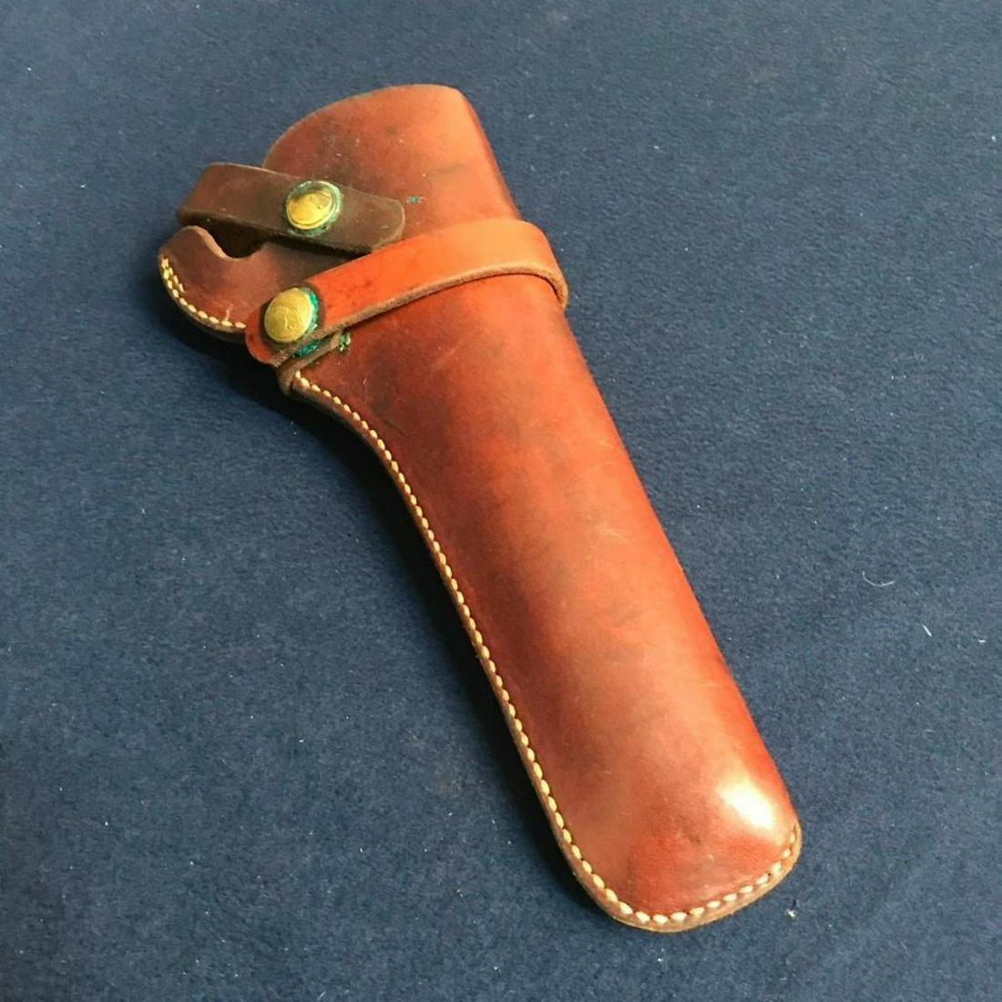 Vintage Hunter Leather Revolver Holster: Vintage brown leather revolver belt holster, stamped Hunter on button snaps & on the leather backside, 1100-52. Fits .22 caliber single action revolvers with 6 - 6.5" barrel lengths, Ruger single six