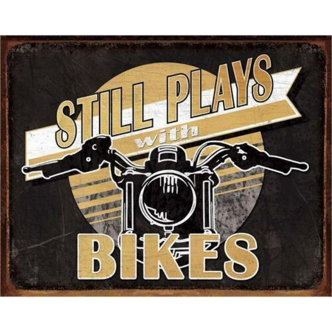 Still Plays With Bikes Metal Pub Bar Sign: Still Plays With Bikes metal pub bar sign. 12 1/2" X 16" with pre-drilled holes for mounting.