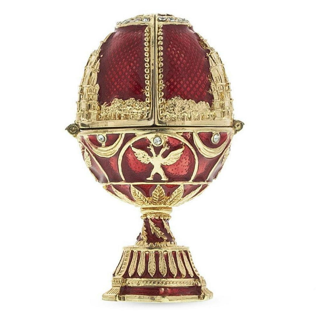 St Petersburg Royal Inspired Russian Egg with Clock: Hand-painted St Petersburg Russian Royal-inspired egg with clock inside. After the designs by Carl Faberge for the Russian Royal family. Enamel & gilt over pewter with inset Austrian crystals. The egg