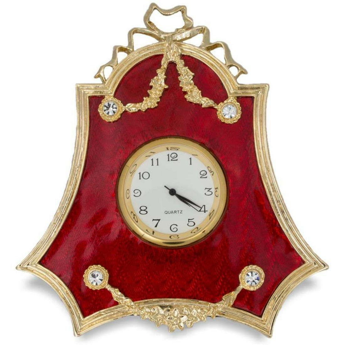 Russian Red Enameled Guilloche Desk Clock: Russian hand-painted red enameled guilloche desk clock. Enamel & gilt over pewter, with ribbon ties & Austrian crystal set laurel garlands. The frame's edges are covered with golden chased laurel bord