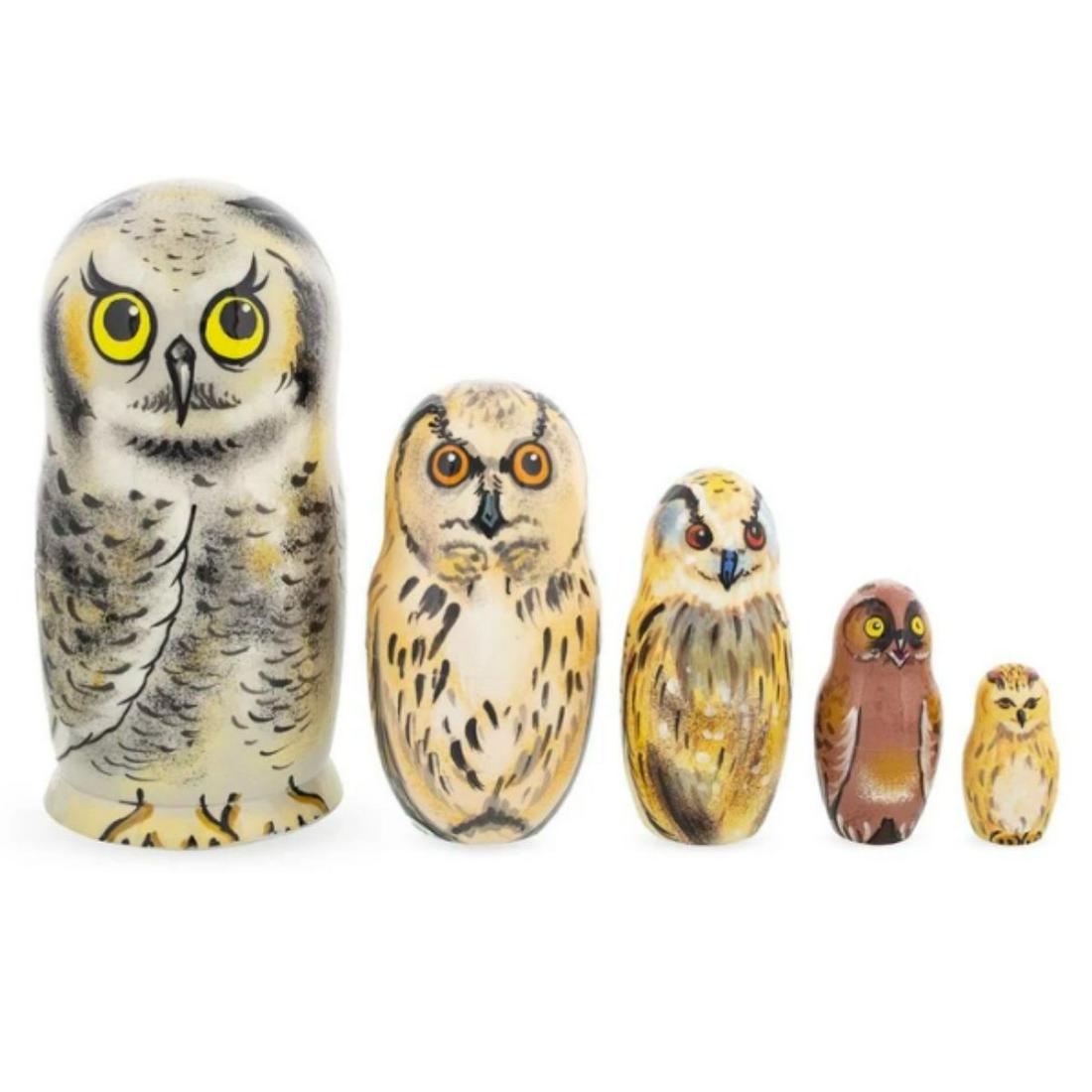 Set of Hand-painted Wooden Owl Nesting Boxes: Set of five Ukrainian artisan made, hand-painted owl family nesting boxes. Gouache over linden wood & coated with lacquer. 6" H X 3" D for largest owl.