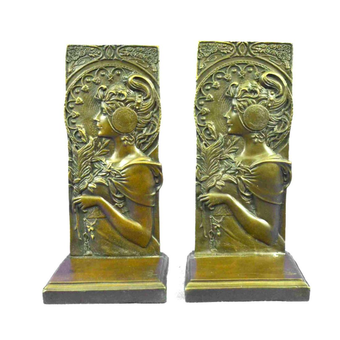 Art Nouveau Style Bronze Girl Bookends: Art Nouveau-style girl bookends. Signed by the artist, Milo. Lost wax casting method bronze, with brown patina. 9" H X 4" W. 9lbs.