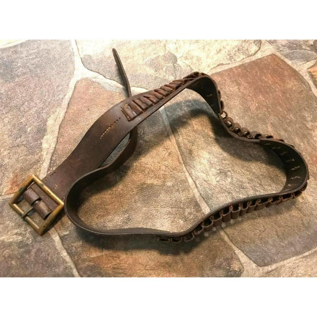 19thc Western Leather Cartridge Belt: 19th Century Old West leather belt with cartridge, ammunition loops, hand stitching & brass buckle. 40 1/2" L. ** lots of wear & age, with two holes punched into the belt.