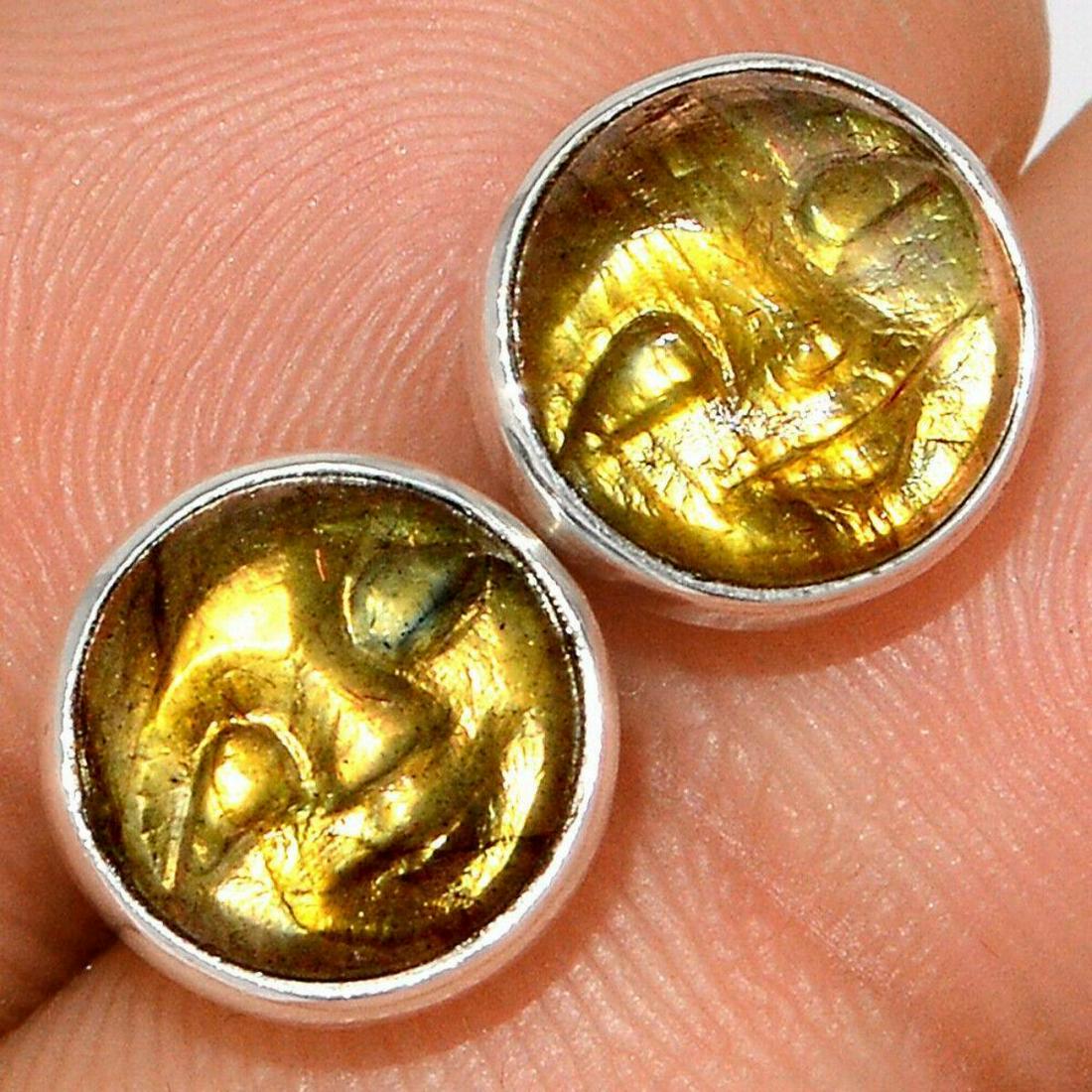 Carved Labradorite Faces Sterling Earrings: Carved golden labradorite cabochon gemstones in the form of smiling faces, set into sterling silver stud earrings. 2.2 grams gemstone & silver.