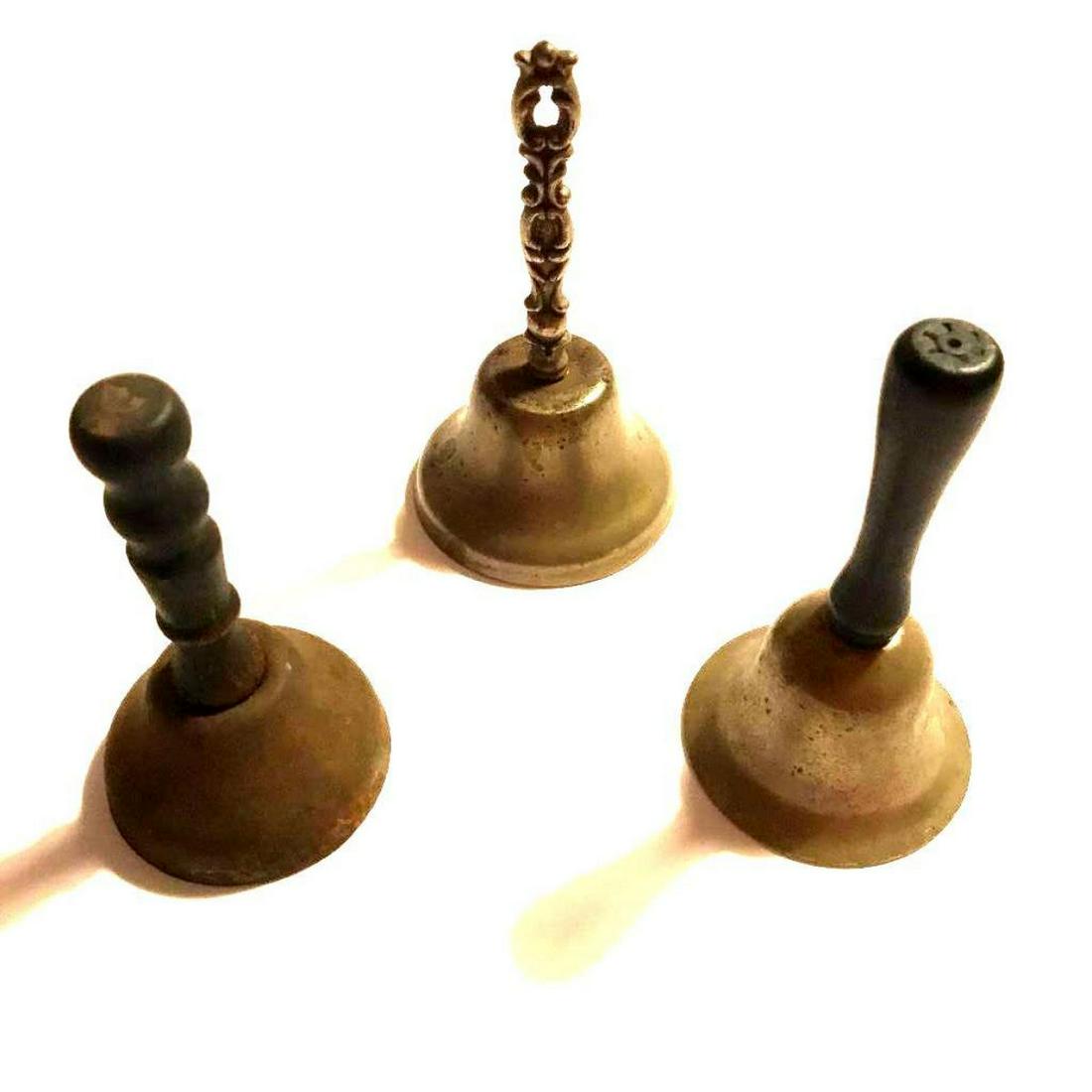 Set of Antique Butler Servants Call Hand Bells: Set of three antique, Victorian & Edwardian era bells for calling servants, the butler. One with ornate pierced handle, the others with wooden turned handles. ** former display pieces in a Victoria er