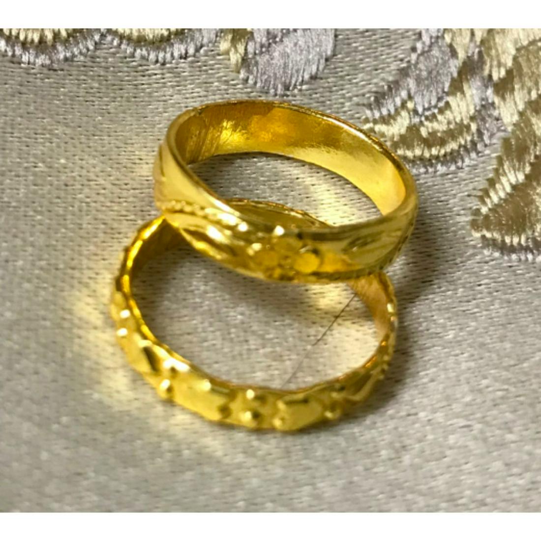 Gold Over Brass Minimalist Poet's Stacking Rings: Pair of 14kt gold over brass minimalist-style poet's stacking rings. Hearts, approx size 6 & flower/ vine design approx size 5.