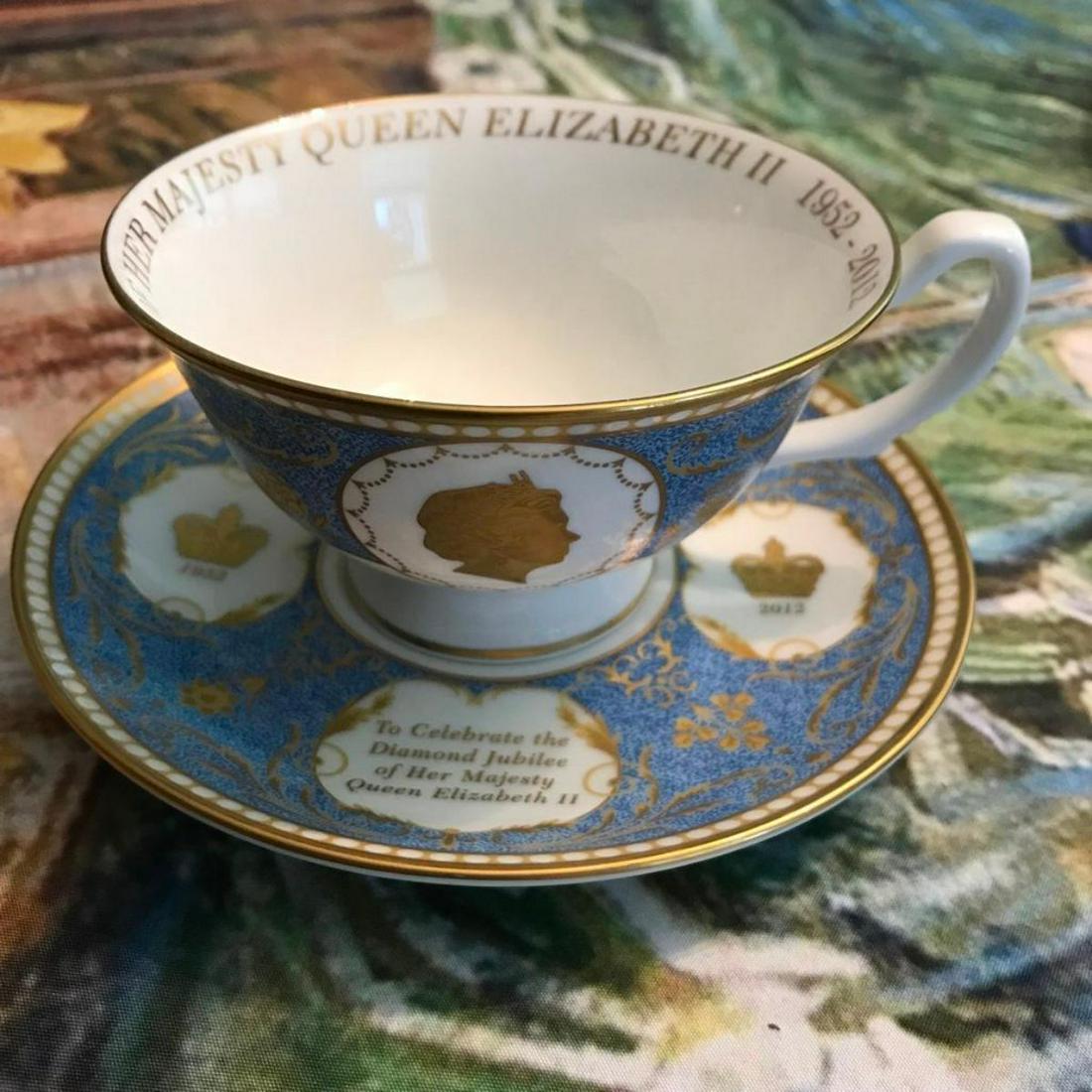 Queen Elizabeth II Diamond Jubilee Commemorative Teacup Saucer Set: Queen Elizabeth II Diamond Jubilee commemorative tea cup & saucer set. Inside the lip of the cup reads: The Diamond Jubilee Of Her Majesty Queen Elizabeth II 1952-2021. The bottom of the cup also says