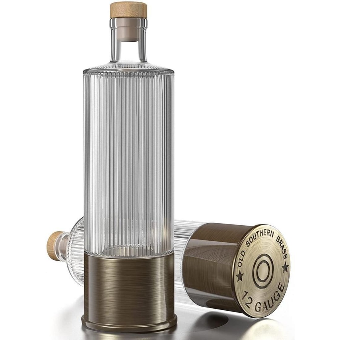 12 Gauge Patriotic Whiskey Decanter: 12 Gauge Shotgun Shell Whiskey Decanter. Old Southern Brass, brass & glass, with removable base, modeled after a 12 gauge shotgun shell. The Second Amendment printed on the side. 750ml capacity.