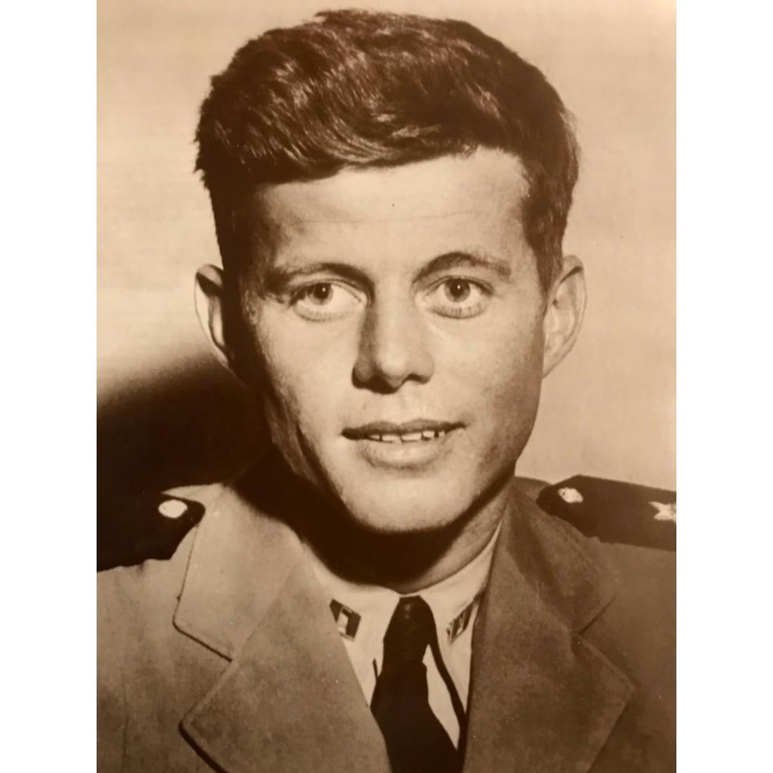 Young John F Kennedy Photo Print: Young John F. Kennedy sepia-tone photo print, on heavy cardstock, created in the early 1990's for The American Heritage Galleries. 11' X 14" in original packaging.