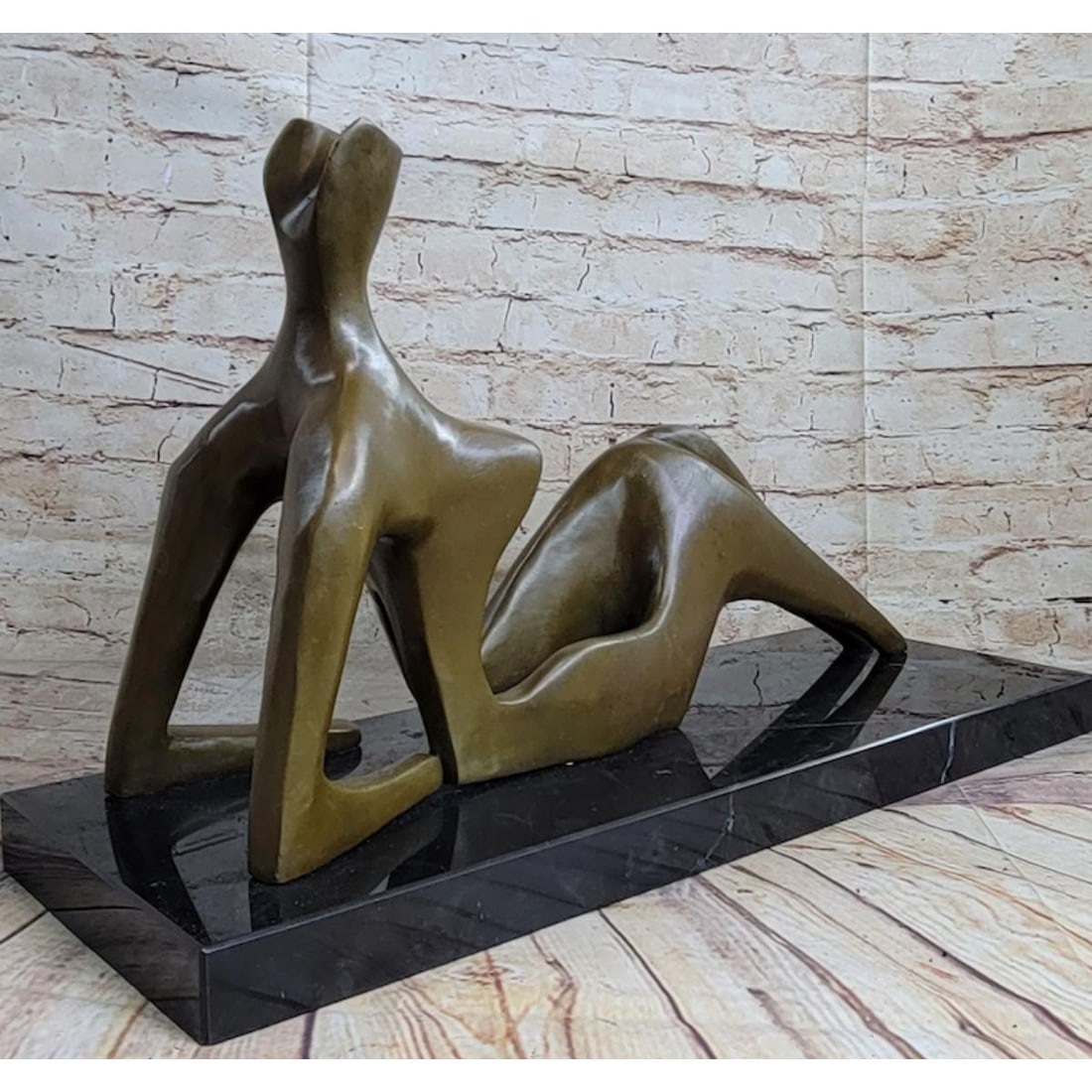 After Henry Moore, Reclining Nude Bronze Sculpture: After Henry Moore, Reclining Nude sculpture. Lost wax casting method bronze, with brown patina, mounted on a marble base. 19 1/2" W X 12" H. 26lbs.