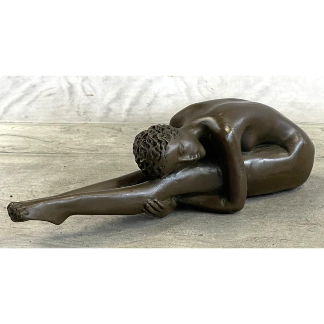 Yoga Pose Nude Bronze Sculpture: Yoga Pose, nude sculpture. Lost wax casting method bronze, with brown patina. Signed by the artist, Milo, at bottom. 9" W X 2" H. 3lbs.