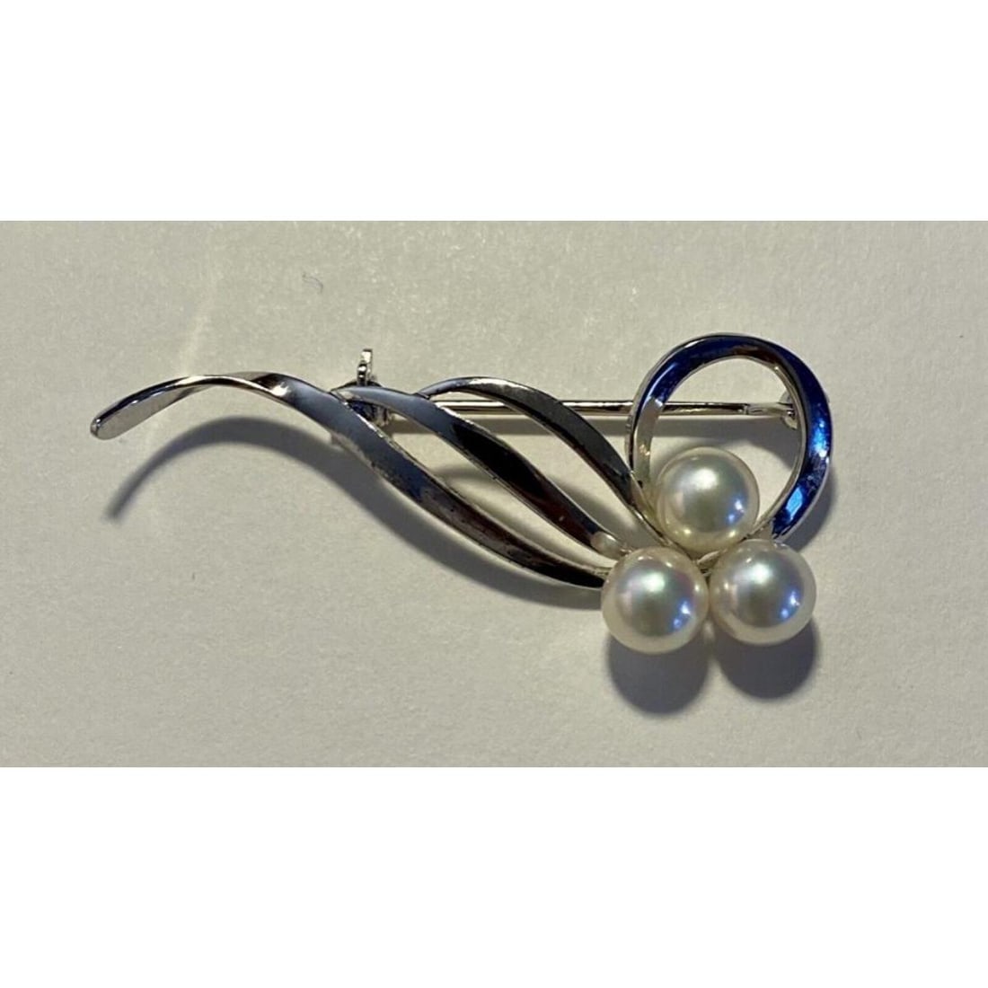 Vintage Signed Mikimoto Akoya Pearl Sterling Brooch Pin: Vintage, mid century, sterling silver, halo style setting, brooch pin, with 3 white, cultured Akoya pearls with a creamy pink cast. The markings inside are the M for Mikimoto's trademark and an "S" fo