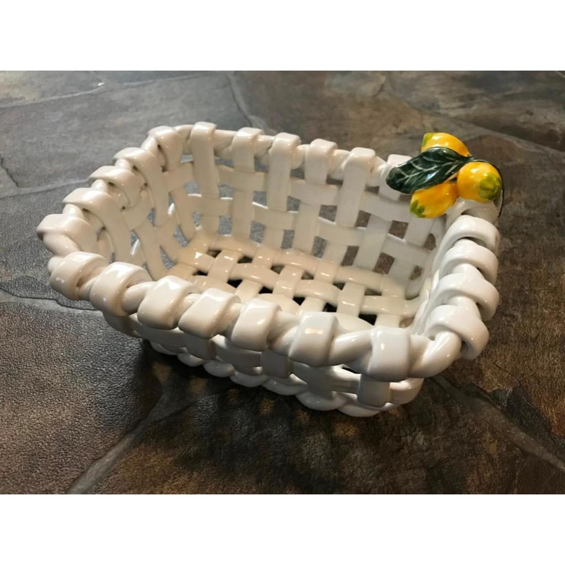 Portugal Ceramic Lemon Basket: Ceramic basket with added lemons accent. Made in Portugal. 8" L X 6" W X 4" D.
