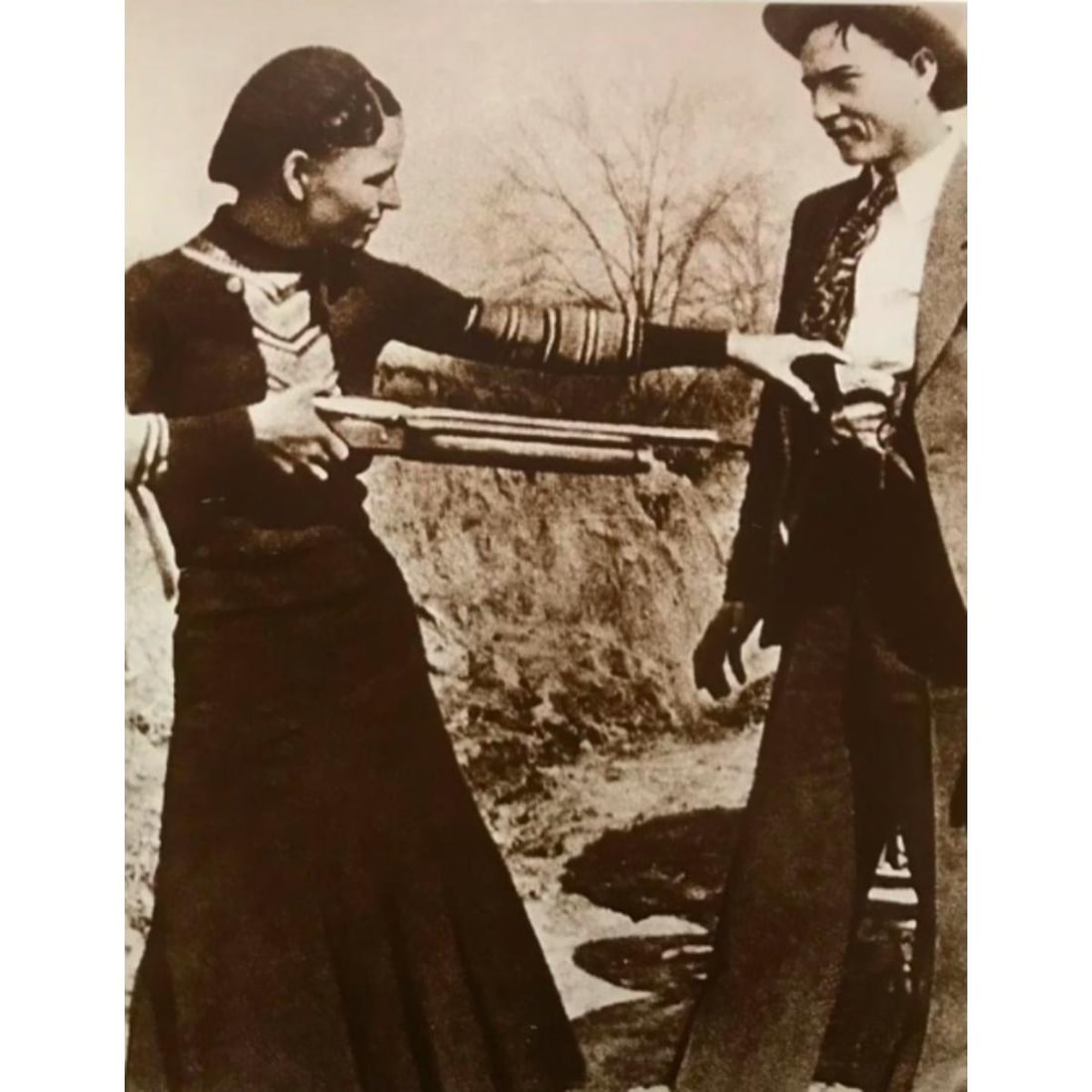 Gangsters Bonnie And Clyde Photo Print: Famous team of 1930's criminals, gangsters Bonnie & Clyde sepia tone photo print. Created in the early 1990's, printed on card stock. 8" X 10".