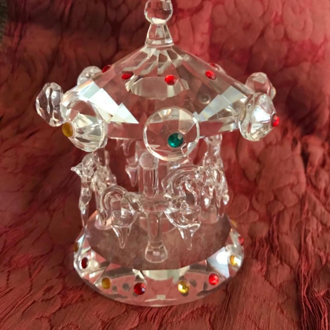 Shannon Crystal Merry Go Round: Shannon crystal by Godinger Merry Go Round collectible figurine with applied Swarovski crystals in red, green & gold. 3 1/2" D X 4 3/4" H.