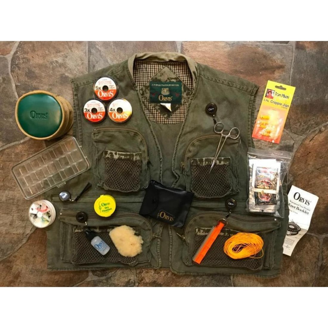 Vintage Orvis Fly Fishing Vest With Accessories: Vintage Orvis brand fly fishing vest ( Size L ) jacket with many accouterments inside. Accessories include: - Orvis Battenkill Fly Reel 5/6 with original pouch. - Orvis plastic snap case with 9 flies.