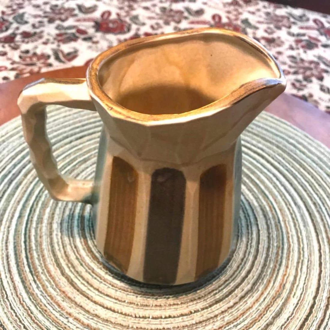 Mid-Century Japan Striped Pottery Pitcher: Vintage mid-century Inarco Japan pottery pitcher in aqua, brown & tan stripes. Original sticker affixed to the bottom. 5 1/2" H X 5 1/2" W with handle. 4" D.