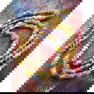 Vintage African Sandcast Trade Beads Necklace: Vintage strand of African sand cast & glass trade beads in beautiful assorted colors together as a a 36" L necklace. A gorgeous piece of hand made artwork.