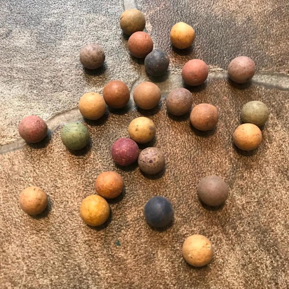 19th Century Clay Children's Marbles: Group of 25 colorful clay children's toys, marbles from the 19th Century. 15mm sized marbles.
