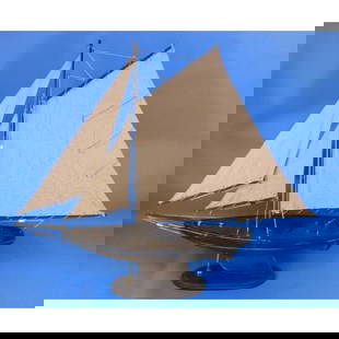 Rustic Newport Wooden Sailing Sloop Model: Rustic Newport wooden model sailing sloop, nautical decoration, with delicately curved hull, keel and rudder & thick, sturdy canvas sails. Pre-assembled, simply attach the masts and display. 30" Long