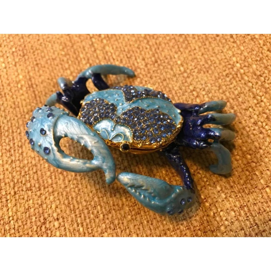 Little Blue Crab Trinket Jewel Box: Little Blue Crab trinket jewel box. Enamel & gilt over pewter, with embedded Austrian crystals. The head of the little crab lifts up, on a hinge, with snap closure, to reveal an enameled interior for