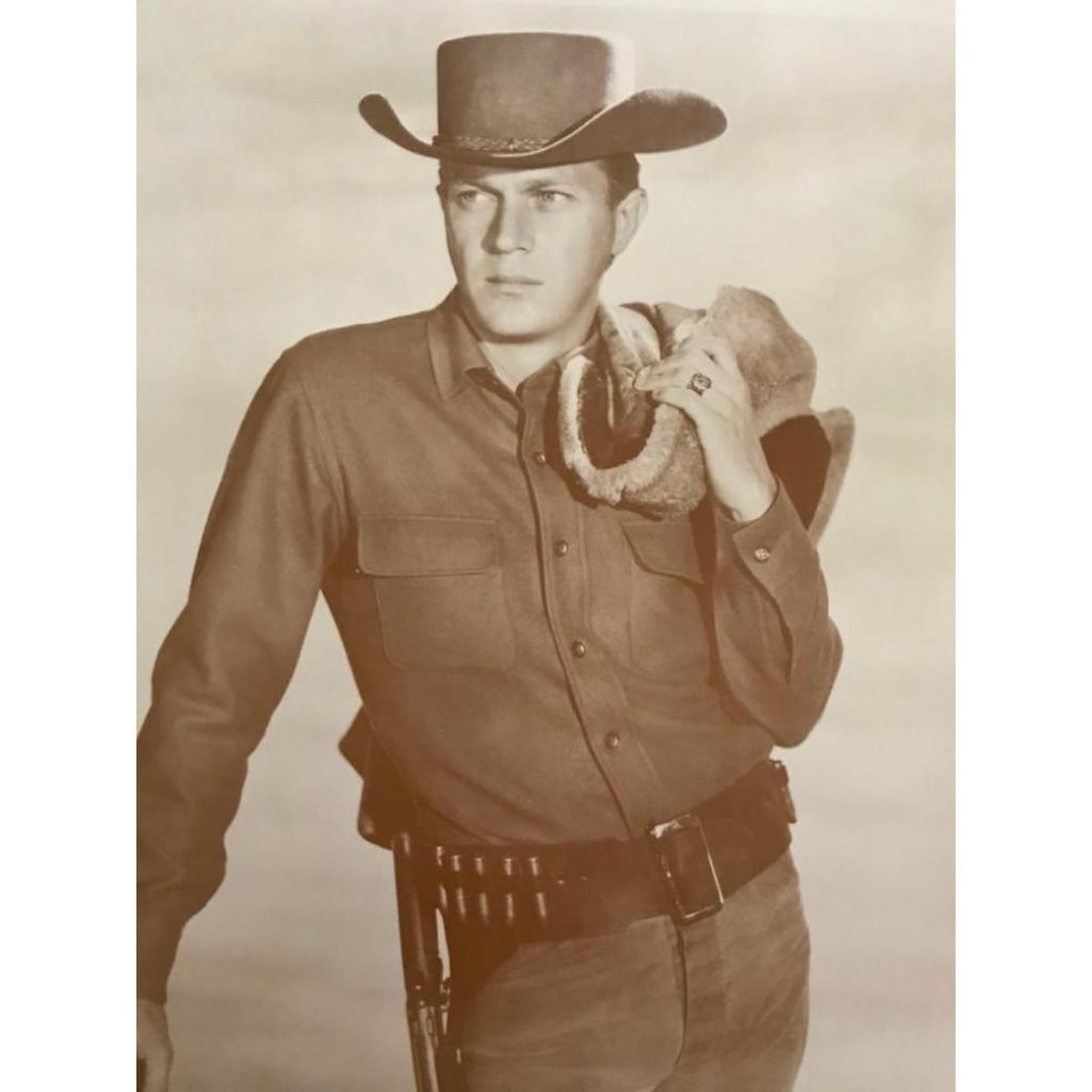 Large Size Cowboy Steve McQueen Photo Print: Large size, 16" X 20" sepia-tone photo print of Steve McQueen in "Wanted Dead Or Alive". Created in the early 1990s for The American Heritage Galleries. Printed on poster stock.