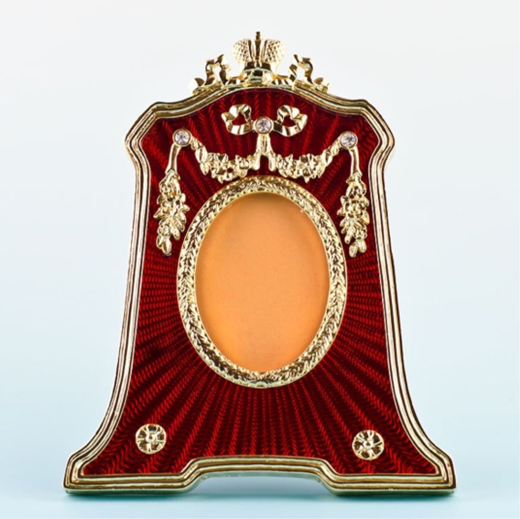 Red Guilloche Enamel Faberge Frame: Red Guilloche Enamel Faberge Inspired Frame Dimensions: 4.5'' (H) x 3.75'' (L) Photo Opening Dimensions: 1.75" (H) 1.25" (W) Pewter, Enamel, Crystals