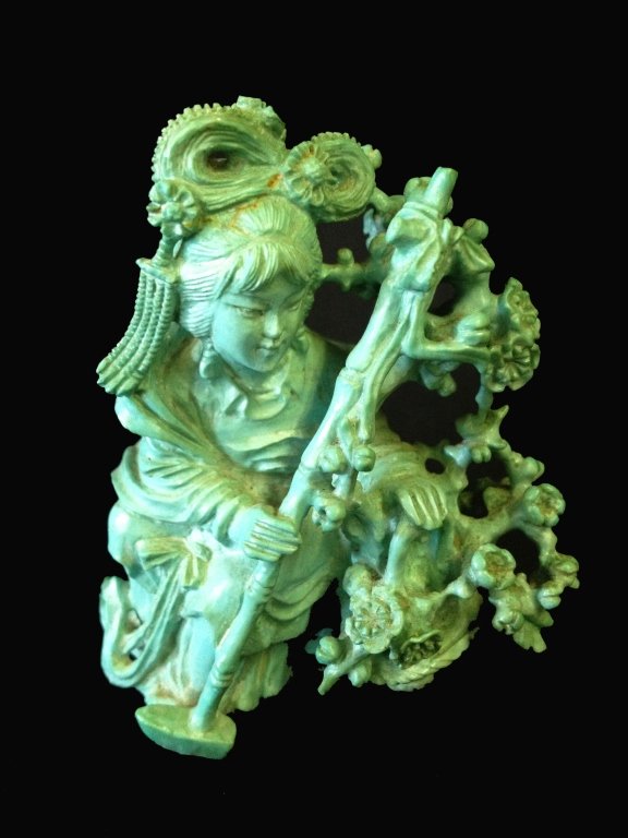 A Chinese carved turquoise figure of a maiden carr: A Carved Turquoise Figure Of A Maiden Carrying A Basket Of Flowers 2 3/4 inches high.