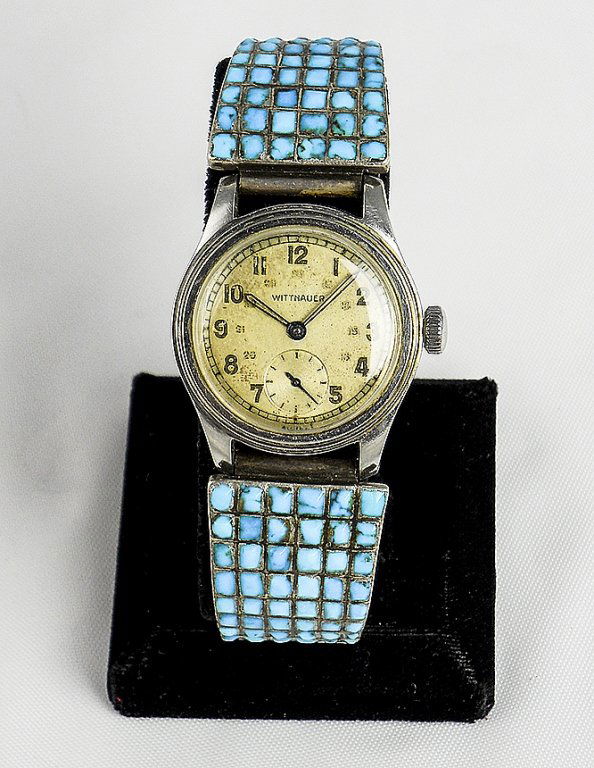 Wittnauer Swiss Made Unisex Turquoise Band Watch: Wittnauer Swiss Made Unisex Turquoise Band Analog Watch With Stainless Steel Stretch Band. Black Numbers And Dials. Sold As Is.
