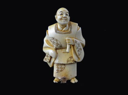 Signed Hand Carved Ivory Netsuke Figure: Hand Carved Ivory Netsuke Figure measures 2 inches tall