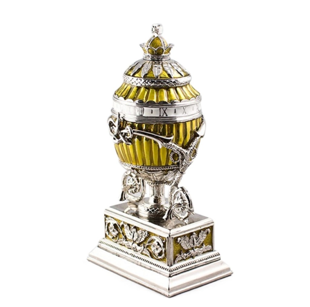 Lilly Bouquet Clock Faberge Inspired Egg: The Bouquet of Lilies Clock Egg (or the Madonna Lily Egg) is a jewelled Easter egg made under the supervision of Peter Carl Faberge in 1899 for Tsar Nicholas II as an Easter gift to his wife, the Alex