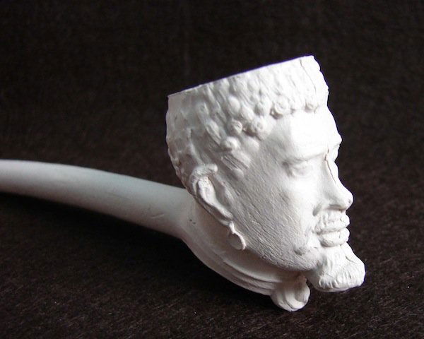Early Clay Pipe depicting the head Southern Slave: Early Clay Pipe depicting the head of Southern Slave during the 1840 to 1860 period. This pipe was unearthed at a tavern site in South Carolina and were most probably cast in the south and given to bi