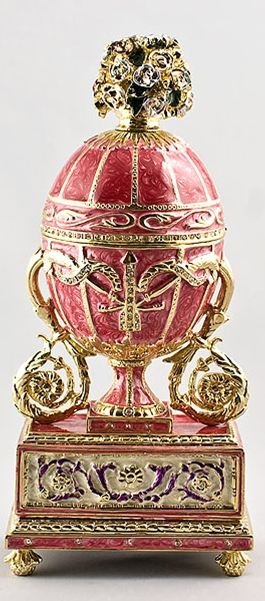 Madonna Lily Faberge Inspired Egg: Madonna Lily Faberge Inspired Egg ¥ 6.5'' (H) X 2.5'' (W) ¥ Weight: 1 lb 9 oz ¥ Pewter, Enamel, Crystals History: Czar Nicholas presented the egg to his wife, the Czarina Alexandra Fyodorovna in 18
